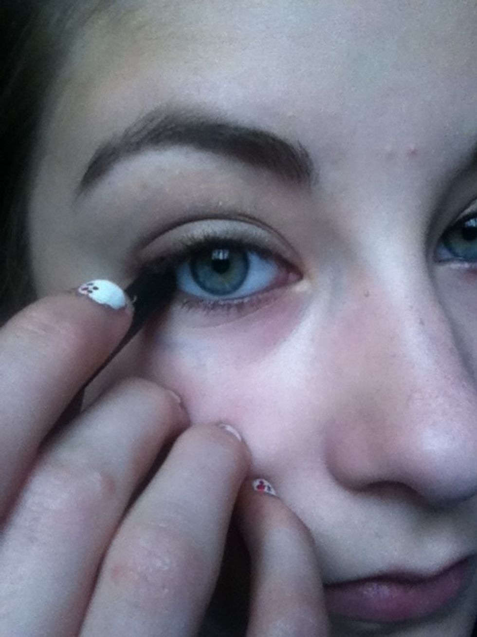 Line top and bottom waterlines with a black kohl pencil.