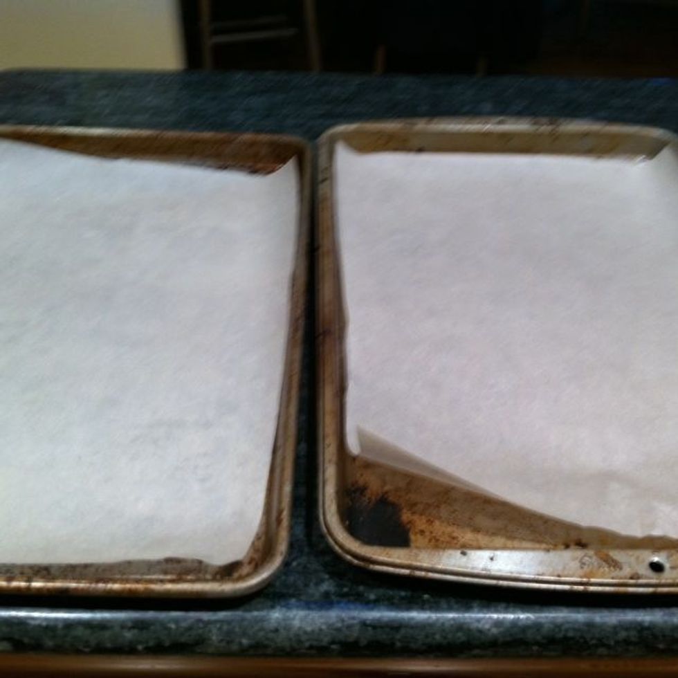 Line two cookie sheets with parchment paper