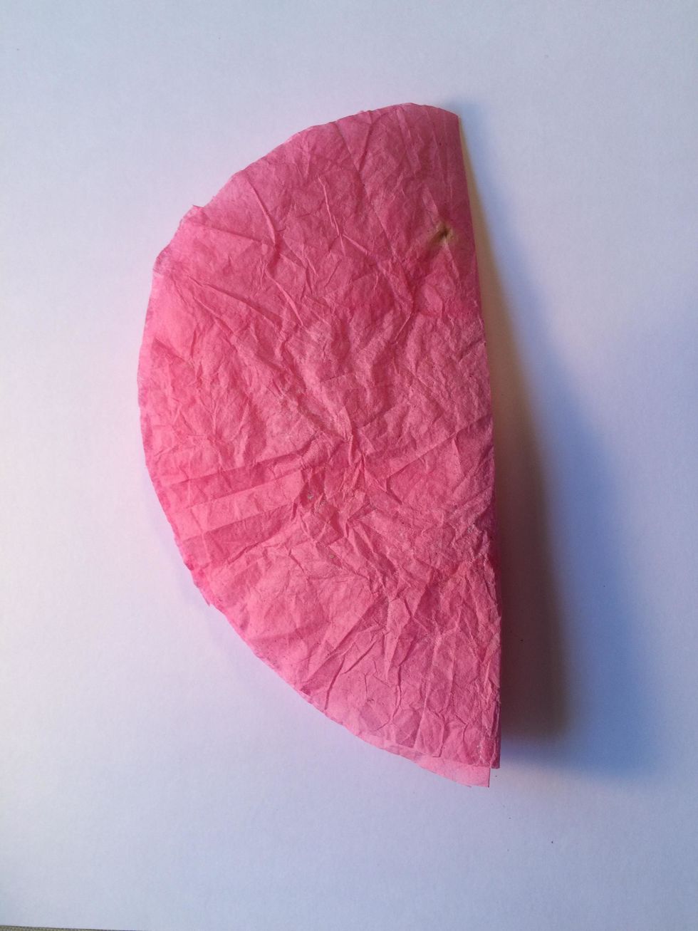 Line up 3 of the small coffee filters, and fold them in half. (You will do these same steps with the large coffee filters)