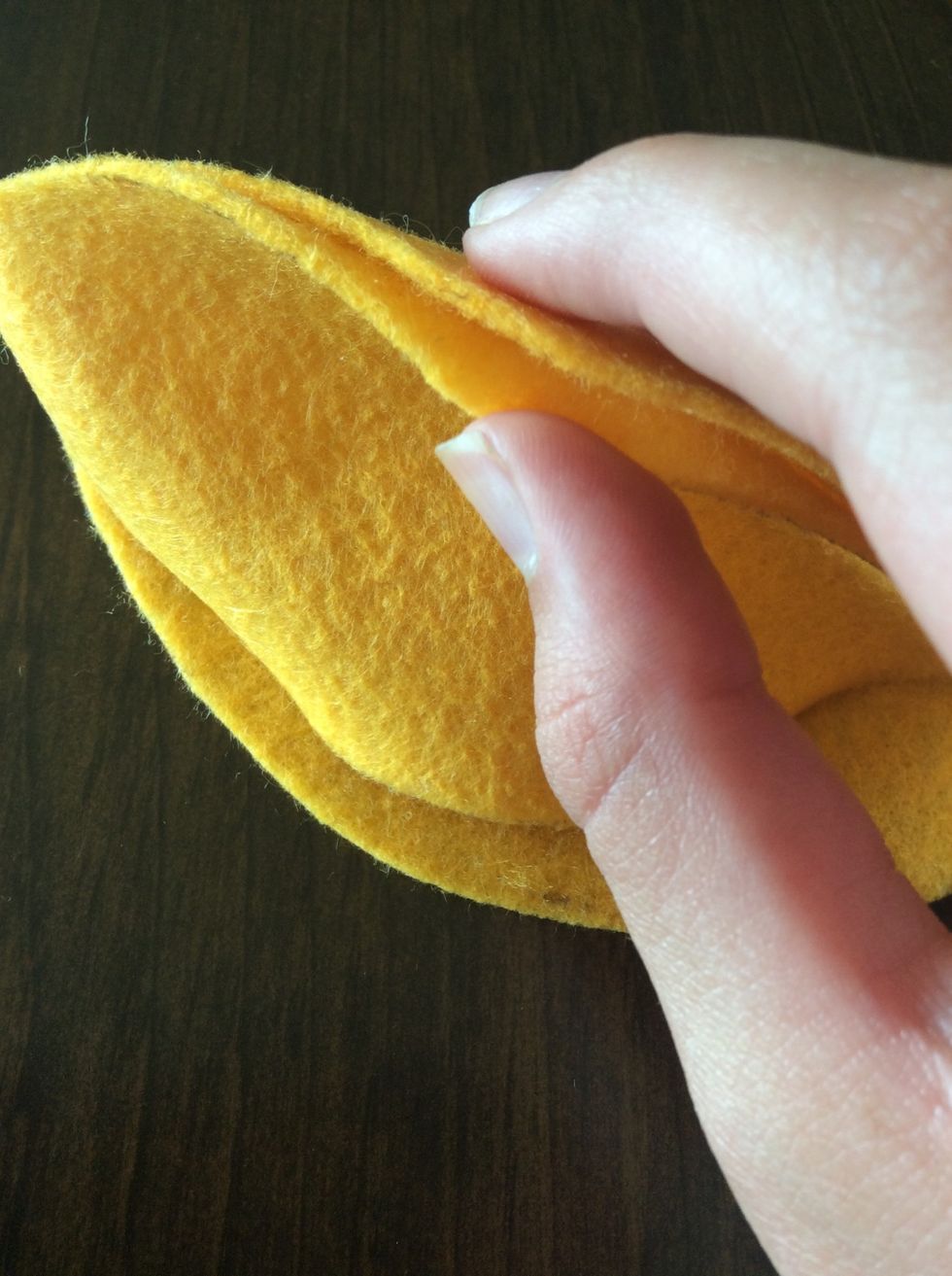 Line up another body piece. Sew a blanket stitch on the edge.