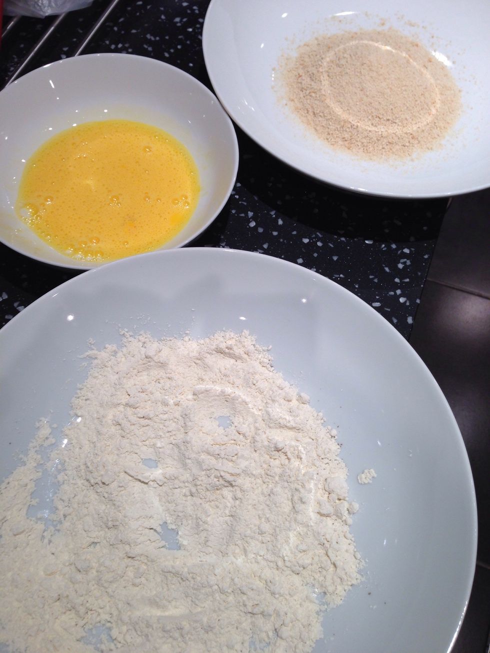 Line up plates that contain flour (with added salt and pepper), beaten eggs, and bread crumbs