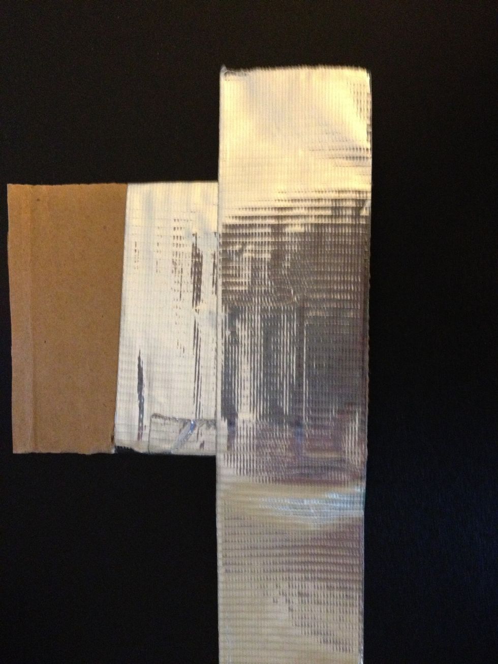 Line up the piece of tape with the edge your cardboard that you measured the tape to.