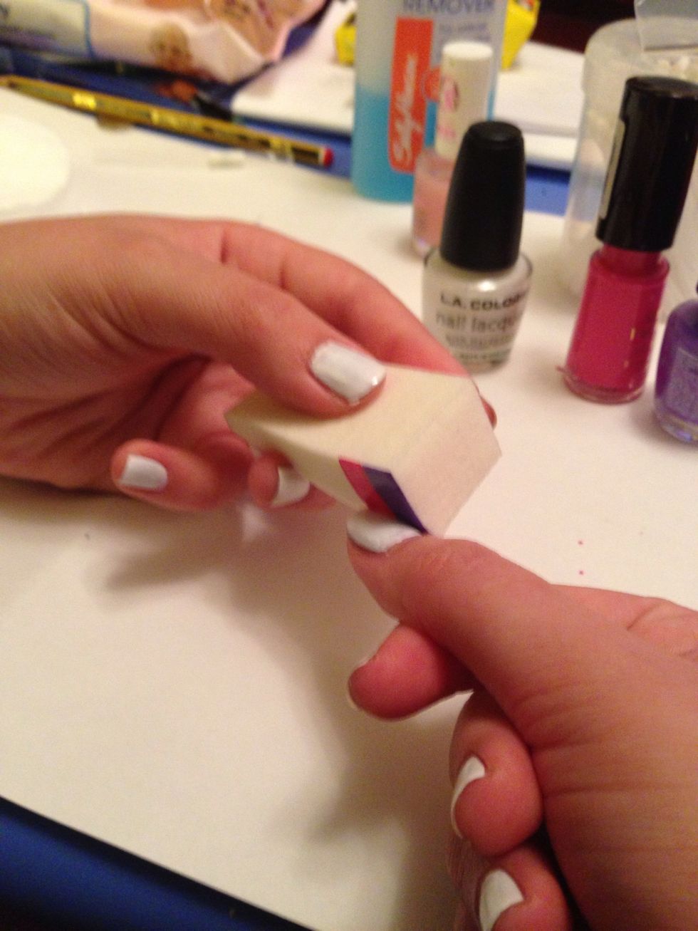 Line up the sponge with your nail, with the base of the sponge at the nail bed. Blot the colour on in a fluid, rolling motion. At this stage it's never neat!