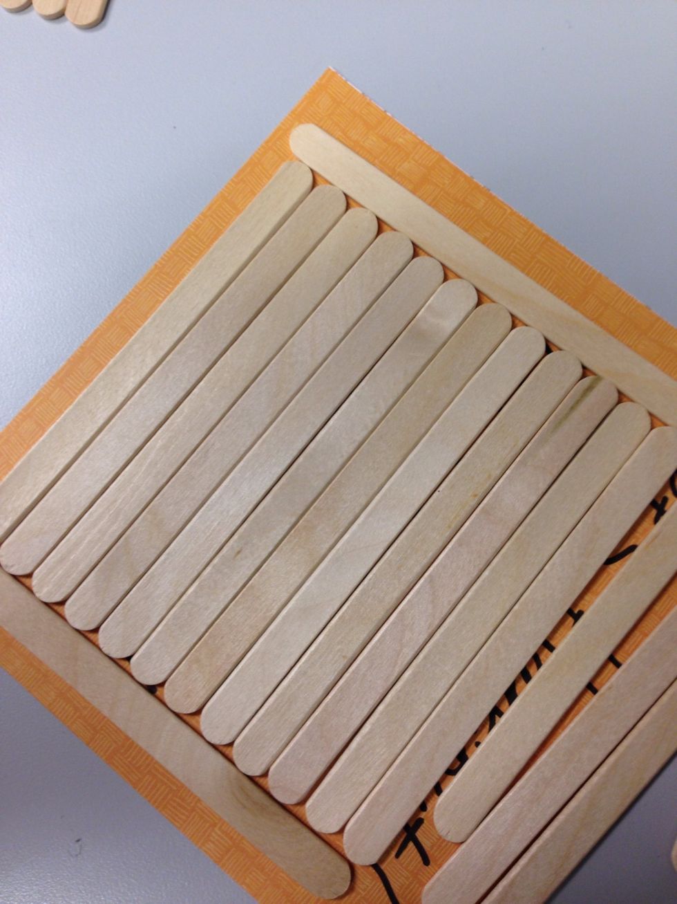 Line up your craft sticks - we used two other sticks to help make them flush