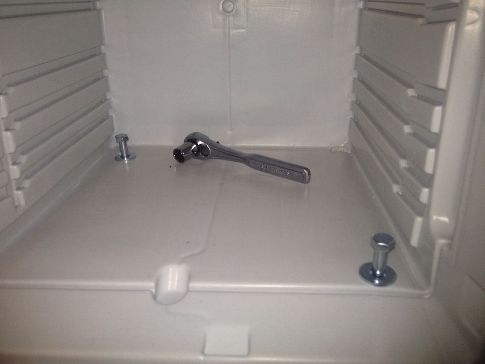 Line up your holes with the bolts, don't forget to use the washers