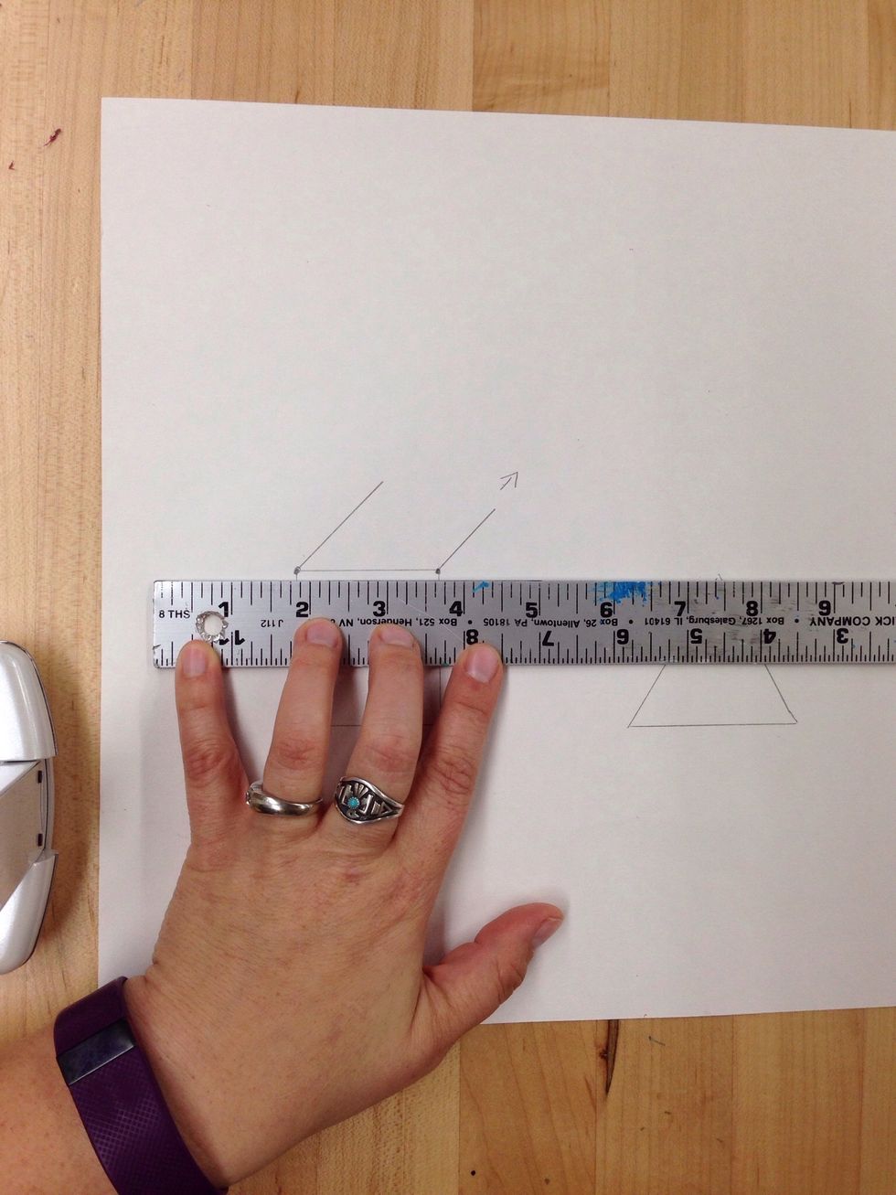 Line up your ruler with the top horizontal line of the square.