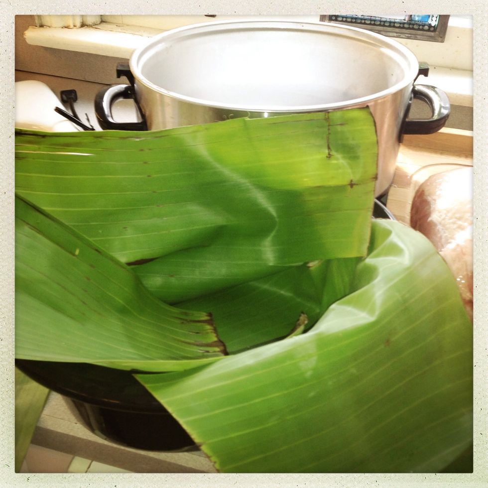 Line your crock pot with banana leaves you can use fresh like mine or frozen.