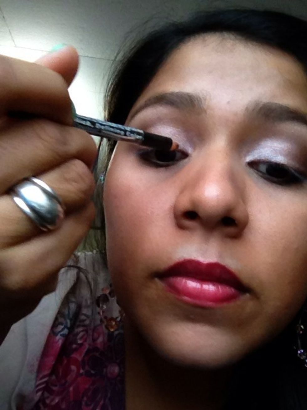 Line your eyes using a coffee eyeliner to combine the rest of the look.
