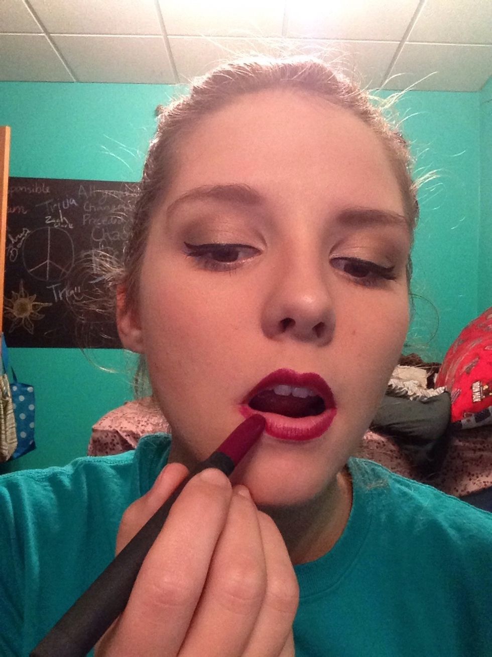 Line your lips with plum lip liner, or I use a lip crayon. Be careful not to severely over line your lips. Be sure to follow closely to the edges of you lips and line your Cupid's bow.