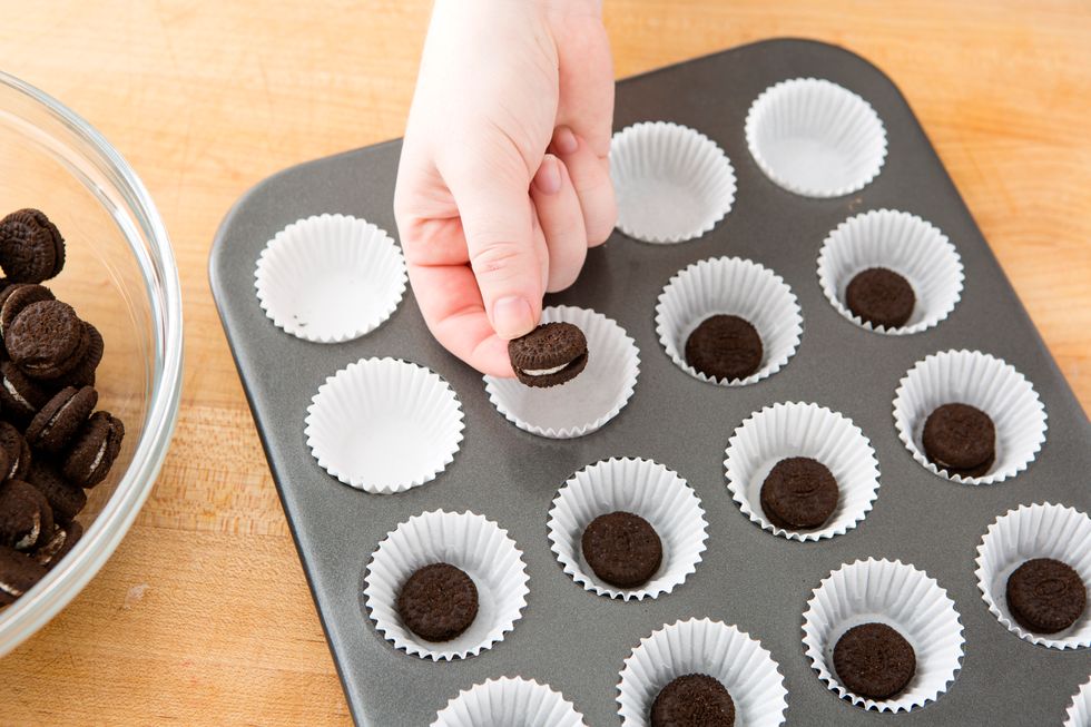 Line your mini muffin pan with mini cupcake liners. Place a whole mini order in the bottom of each liner. Then, set the pan aside.