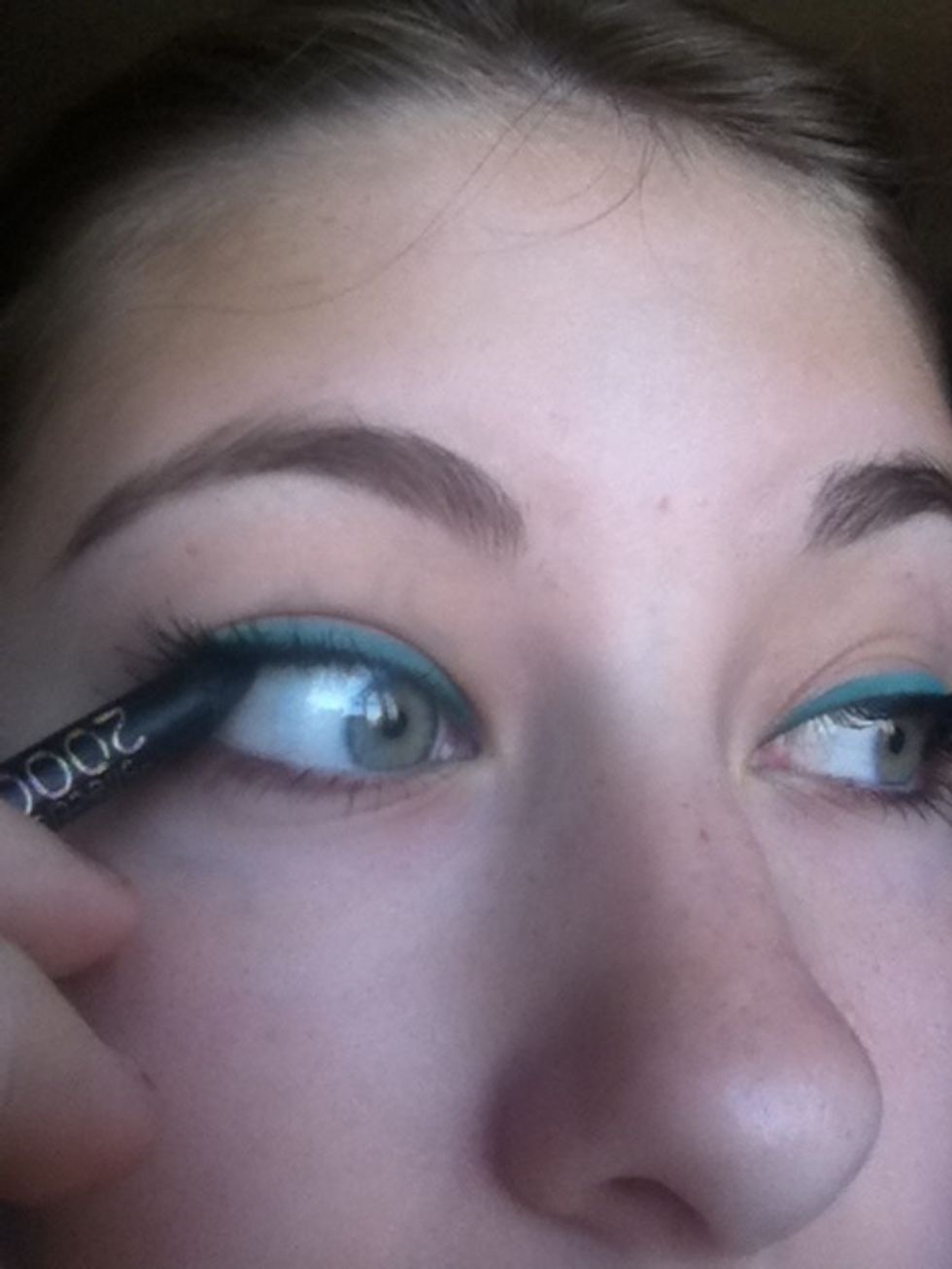 Line your upper lashlines with a black kohl pencil.