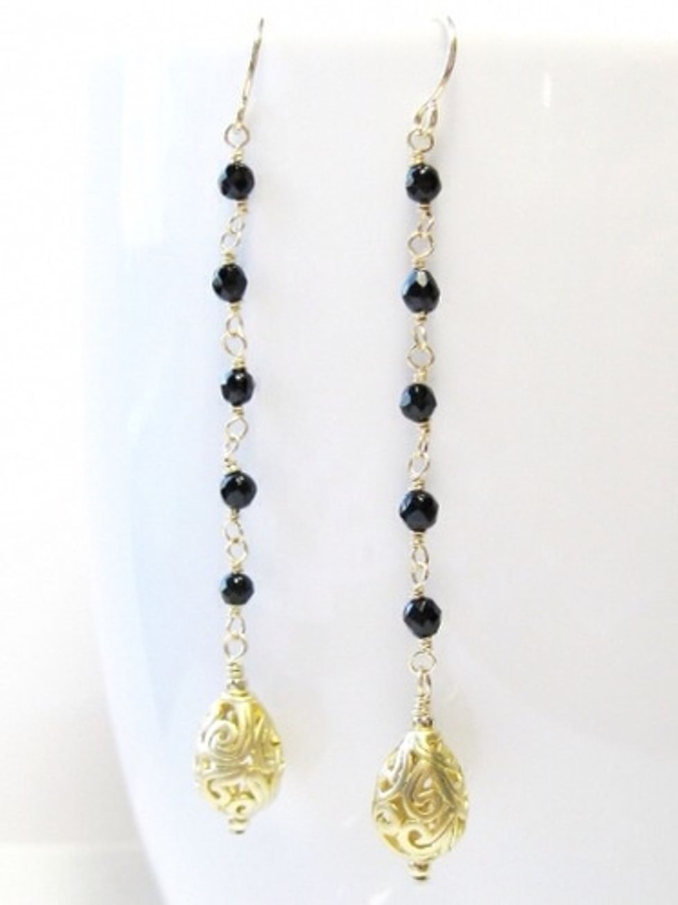 Linear Black Drop Earrings A long row of small faceted gemstones hols a beautiful filigree drop. $64