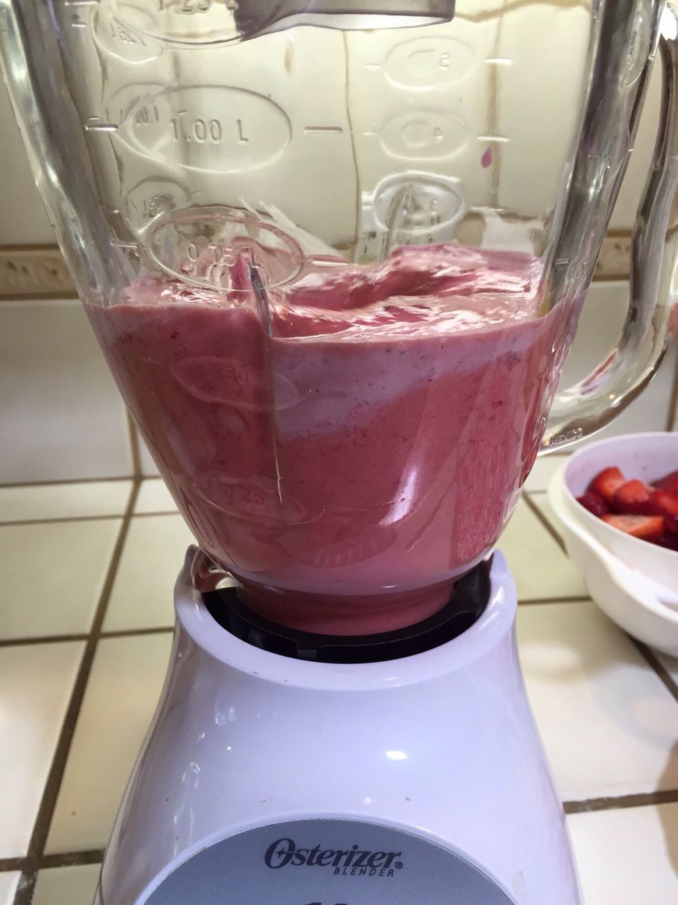 Liquify strawberries in blender.