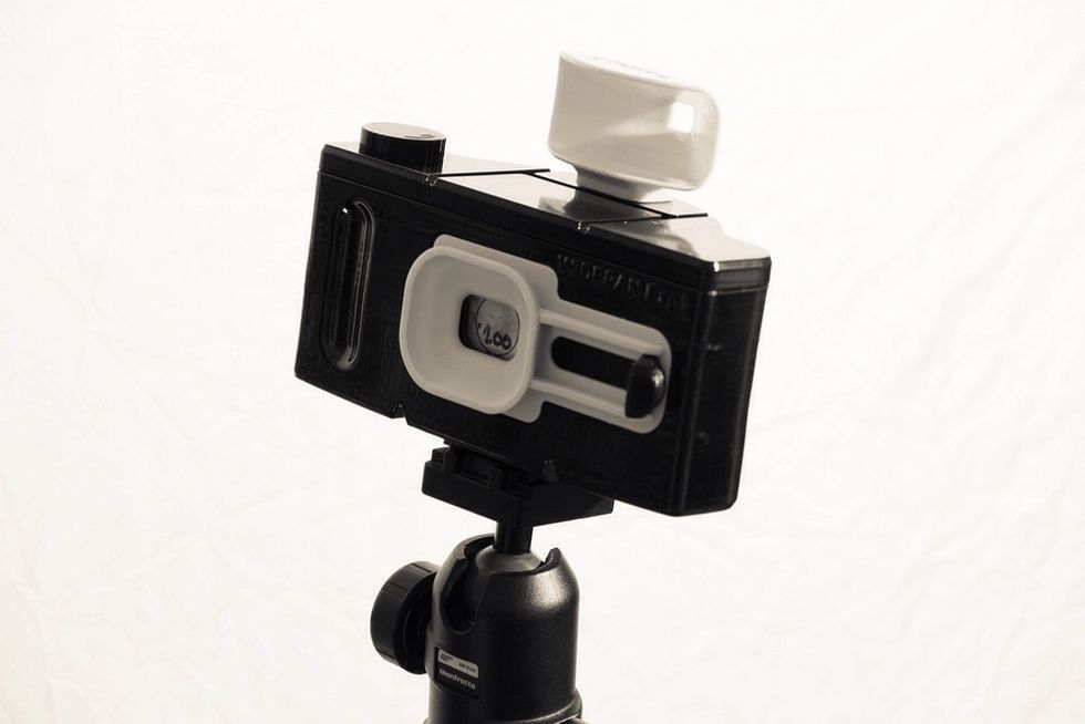 Load film in a film change bag, add the lid take out of bag and advance film to even frames 2, 4, 6, 8, 10 & 12.