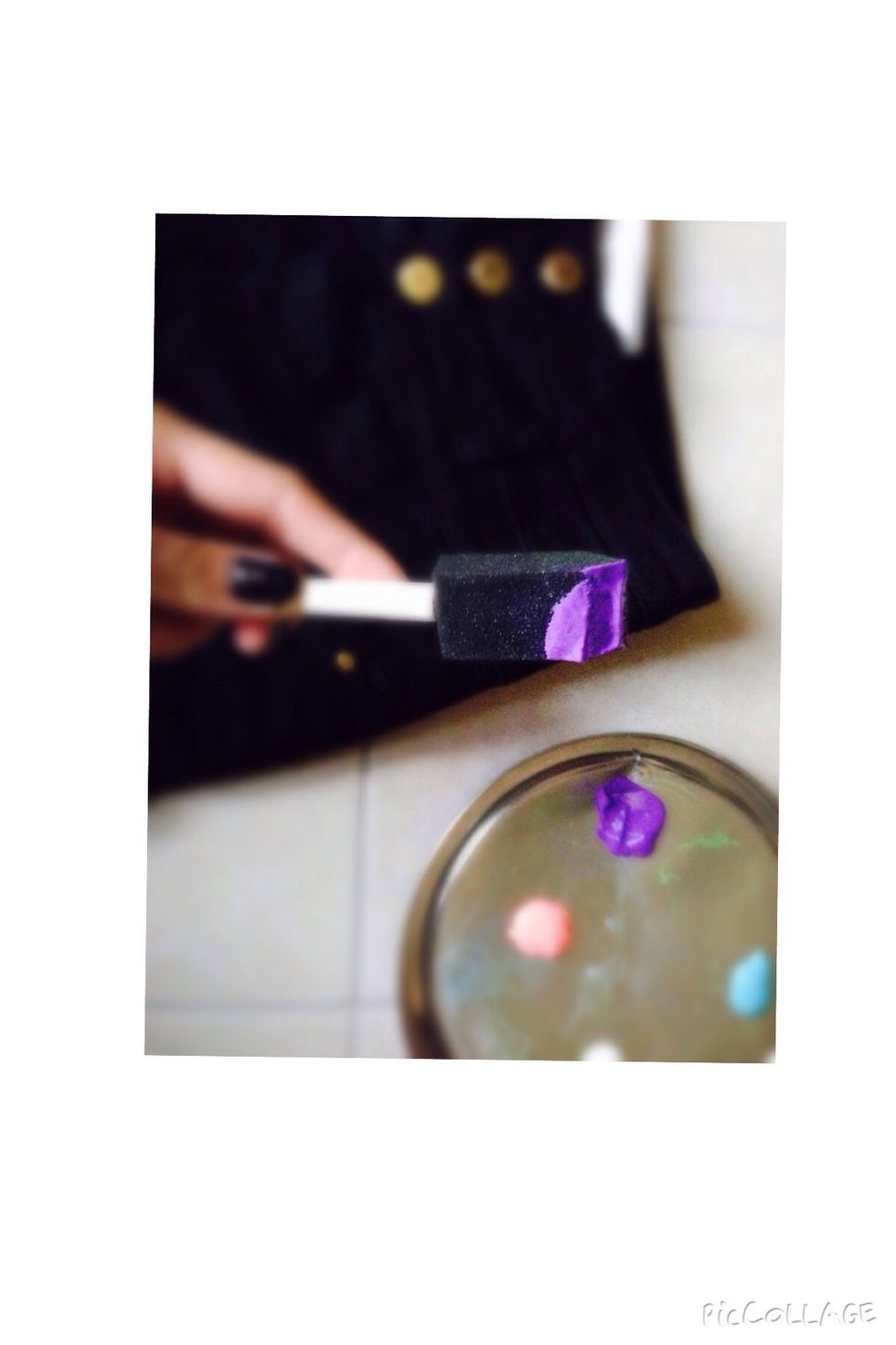 Load one of your sponges with the purple fabric paint.