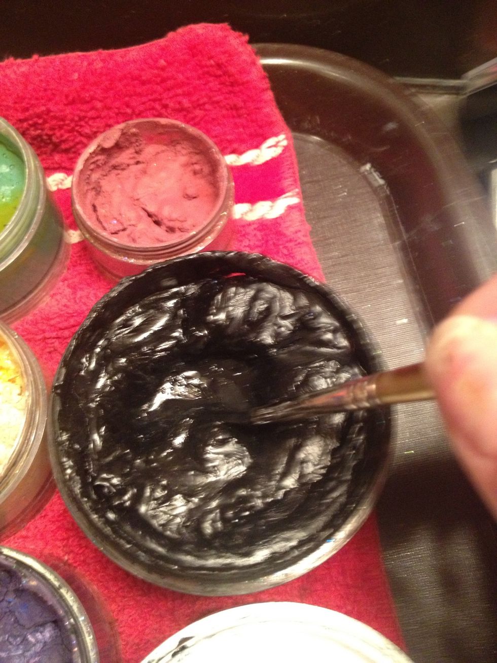 Load up an outline brush with Wolfe black.