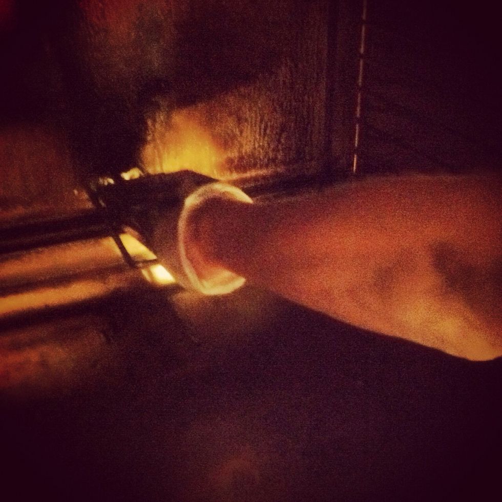 Load wood cop box into the oven