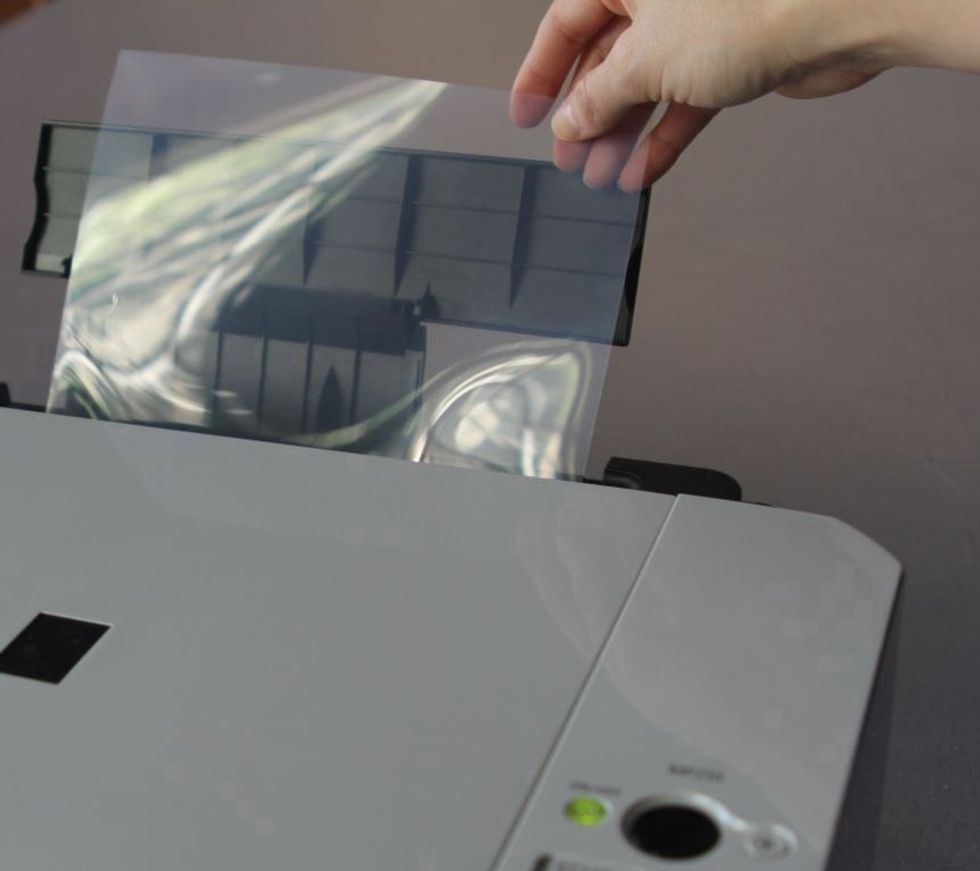 Load your Inkofilm in the printer so that the sticky inkjet-receptive side will be printed. You may want to run a print test with a regular sheet of paper to find out the proper way to load your film.
