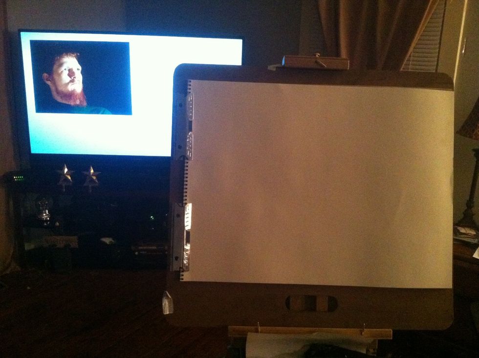 Load your picture onto an online site or email account then view using your tv and Internet connection. I use my Xbox 360 and Internet explorer and an email account.