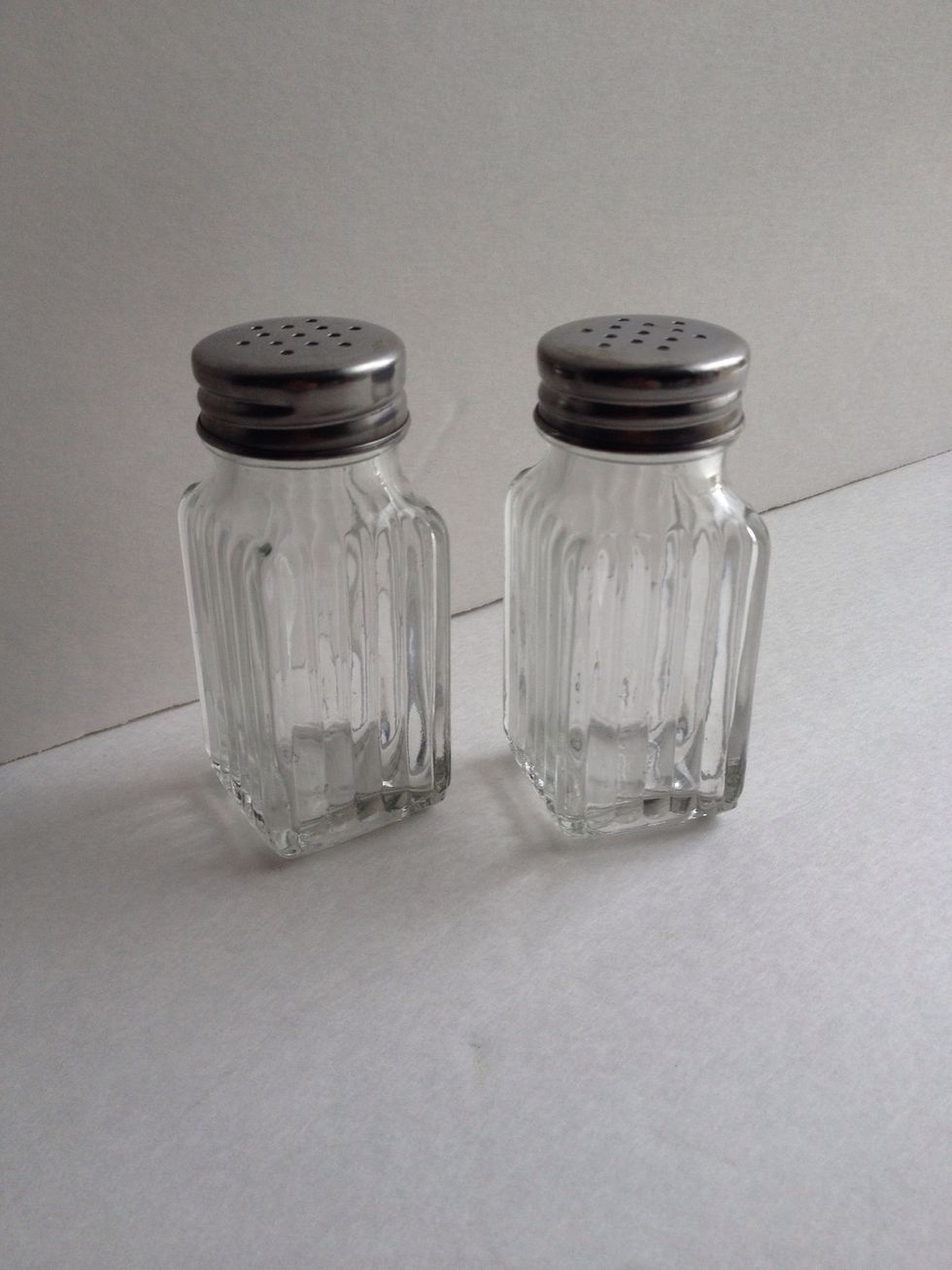 Locate a pair of old-fashioned salt and pepper shakers. These ones measure a about 1.5" wide by 3.5" tall.