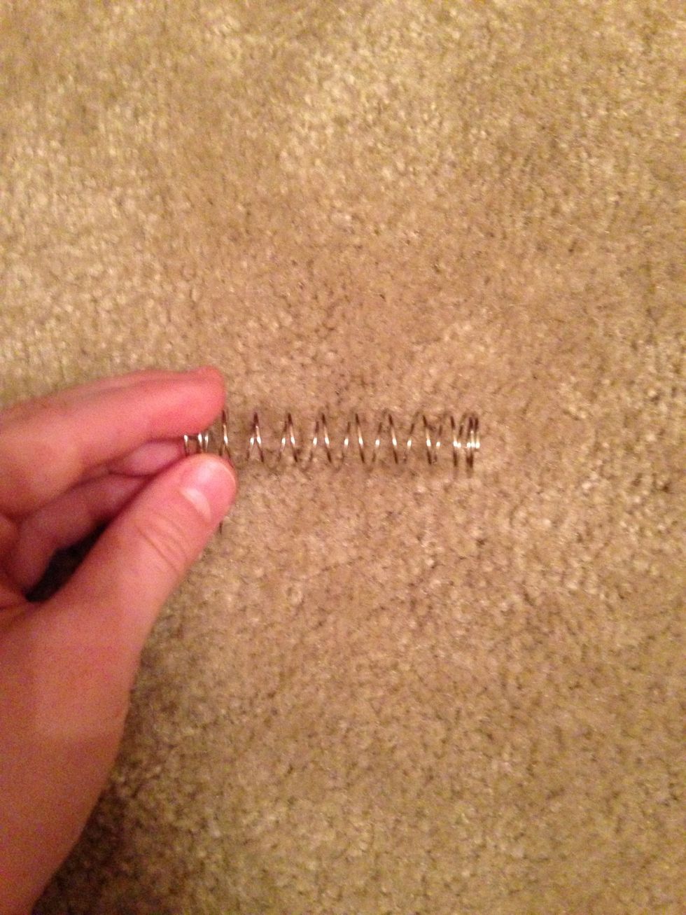 Locate and take out the spring that is found in the Nerf Gun.