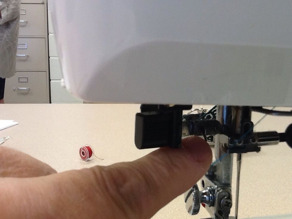 Locate the clip on the top of the needle which will guide your thread down to the needle.