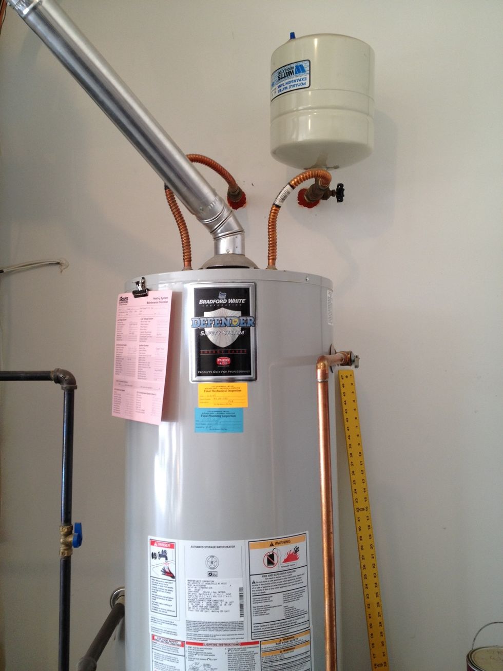 Locate the cold water line and shut-off valve.