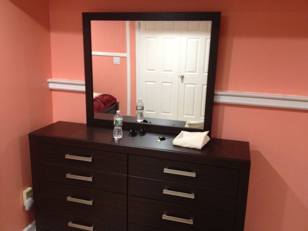 Locate the dresser and the stuff that needs to be cleaned