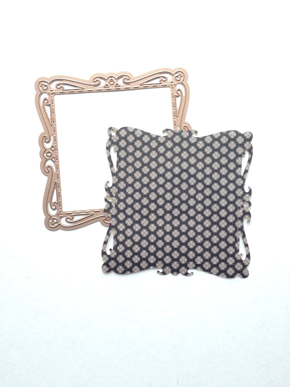 Locate the "Fashion" paper from your 12x12 pad and cut a 4.5" square. Use your die cutting machine and largest die from the Spellbinders Captivating Squares die set to cut paper.