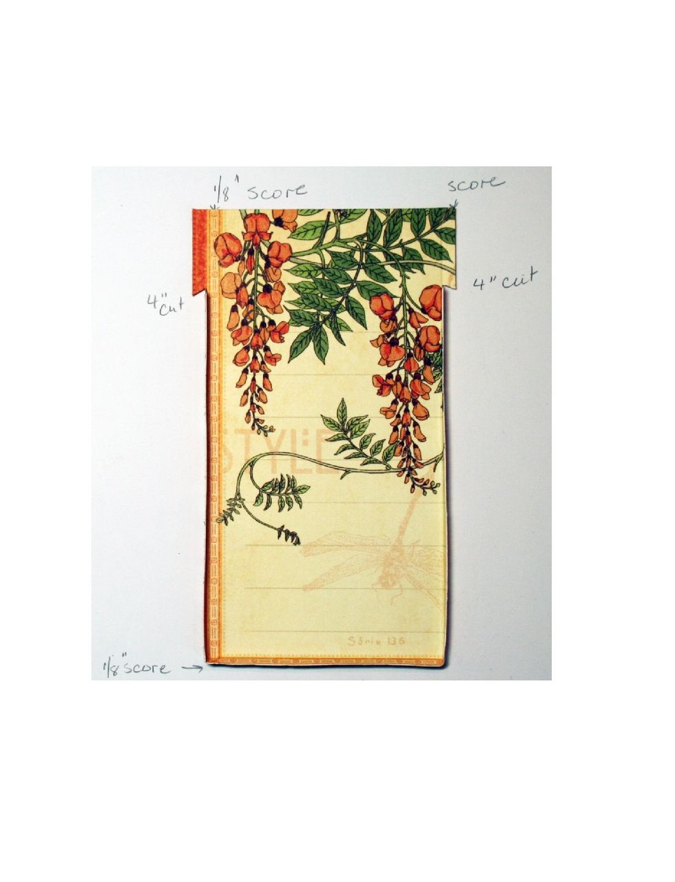 Locate the pictured cutapart on the Attention to Detail paper.  Trim to 2.75" w x 4.5".  Score the sides and bottom at 1/8".  Cut a diagonal slit at 4" on both sides as shown in the photo.