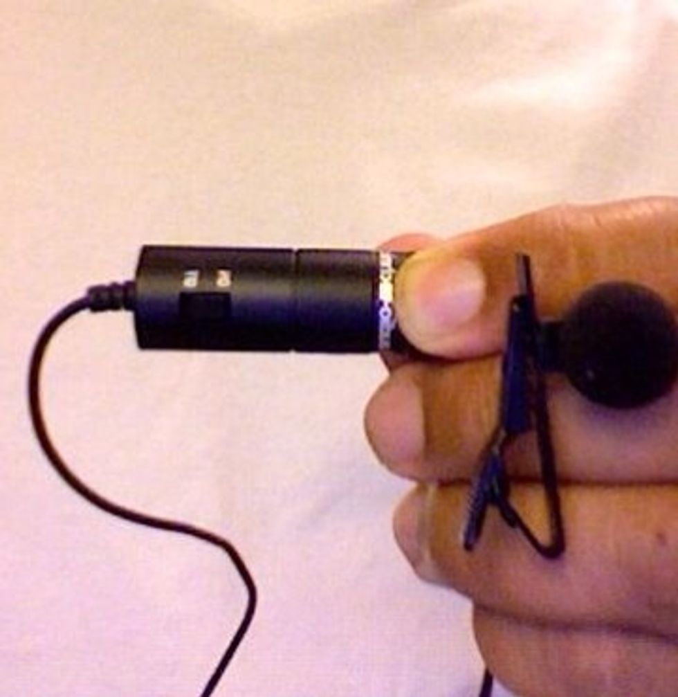 Locate the power button on the external mic and switch it on.