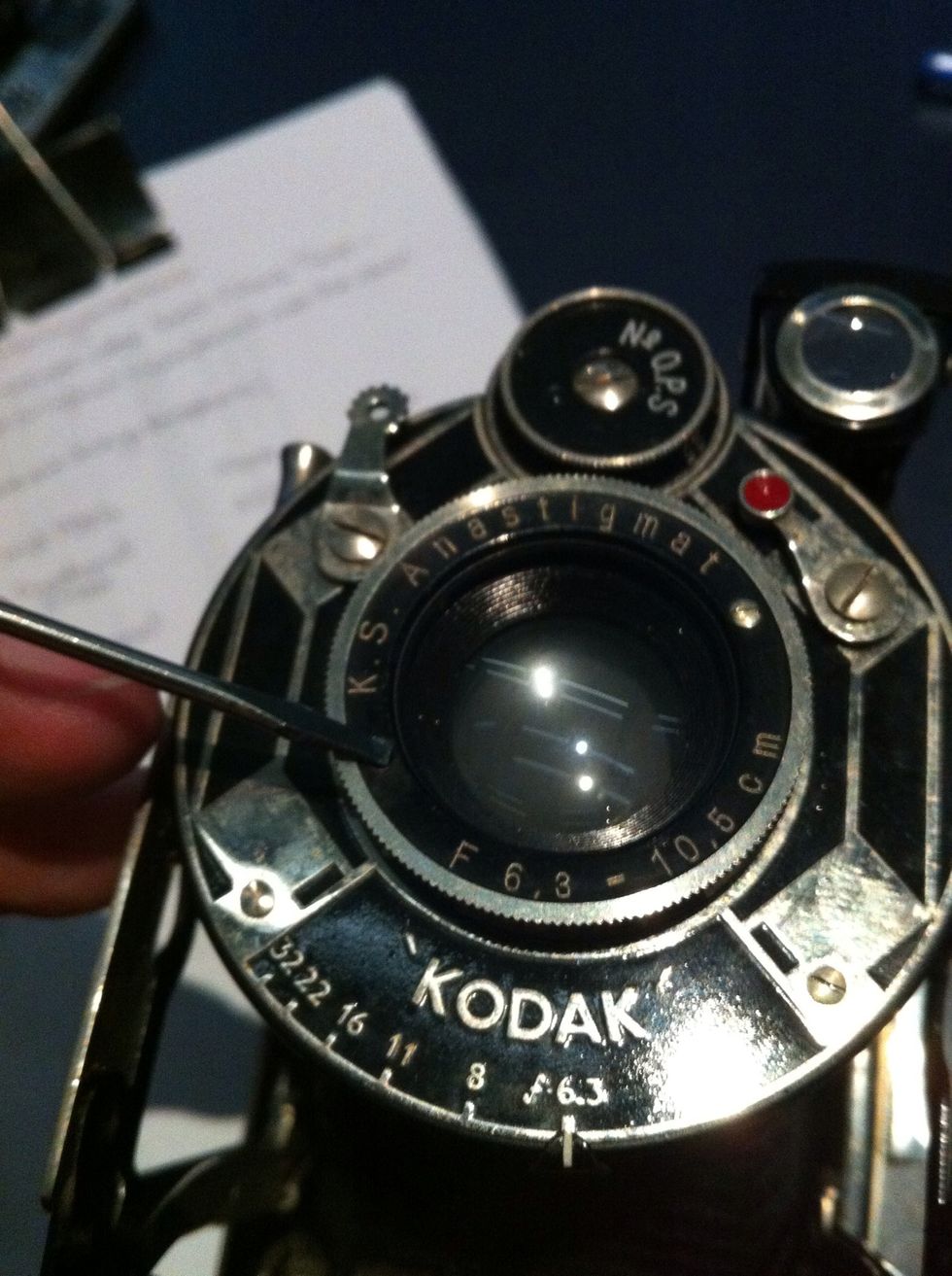 Locate the tiny screws holding the Ring on the front lens. If yours doesn't have a front skip to the back part.