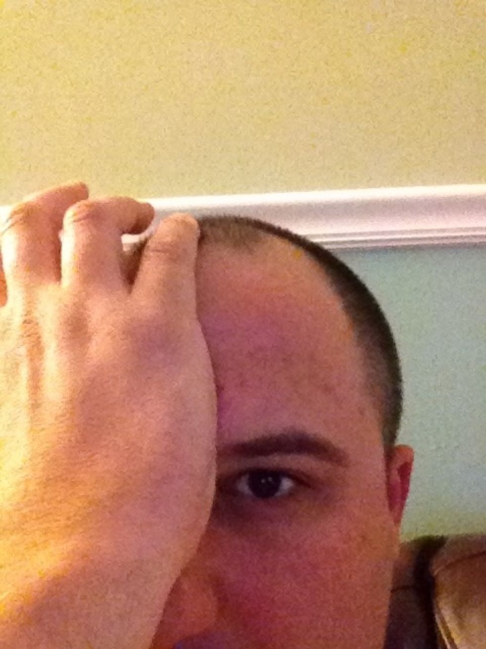 Locate this point by placing the base of your palm on the bridge of your nose. Have the pinky line up with your midline. The point is located under the tip of the pinky.