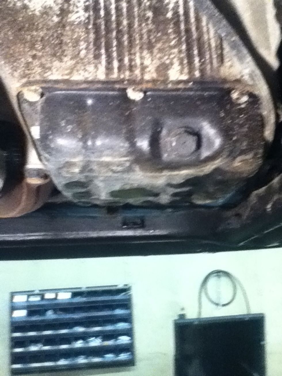 locate your vehicles oil drain plug
