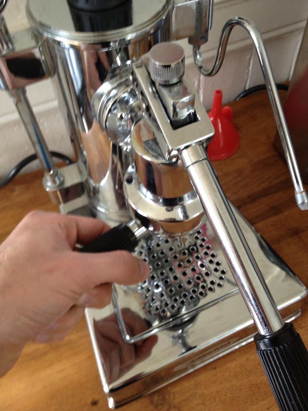 Lock & load. Load the portafilter with the handle just shy of 9 o'clock and rotate to lock at the 7 o'clock position.