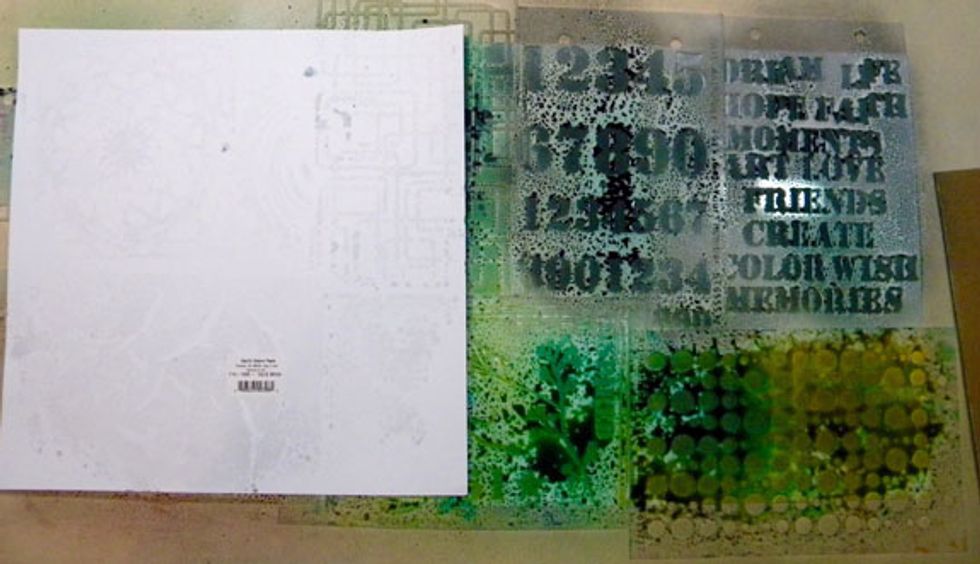 Look at all that spray on the top of the stencils! I can't waste it so I took two more pieces of white cardstock and placed it over the stencils.