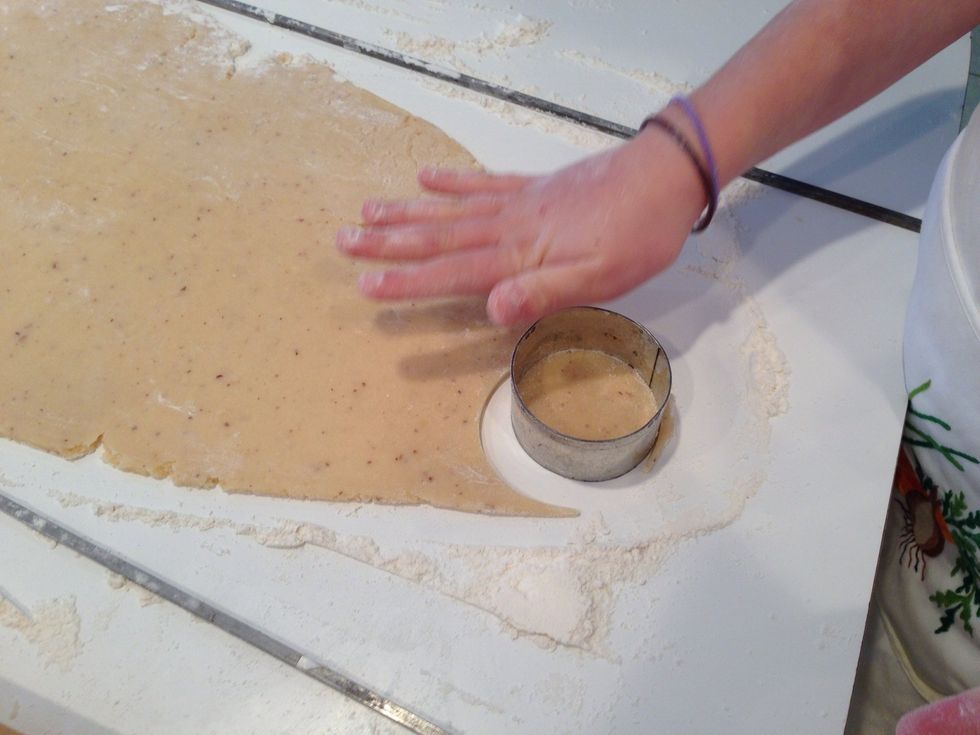 Look at that perfect dough! Try to get as many cookies as you can. The scraps will get collected and put back in the fridge. Repeat until dough is gone.