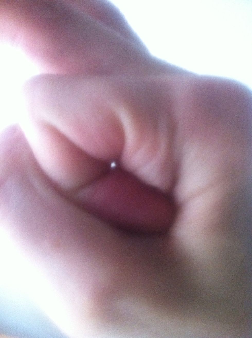 Look at what you want to see in focus through a tiny pinhole. You can form one by curling your finger as you see in this image...