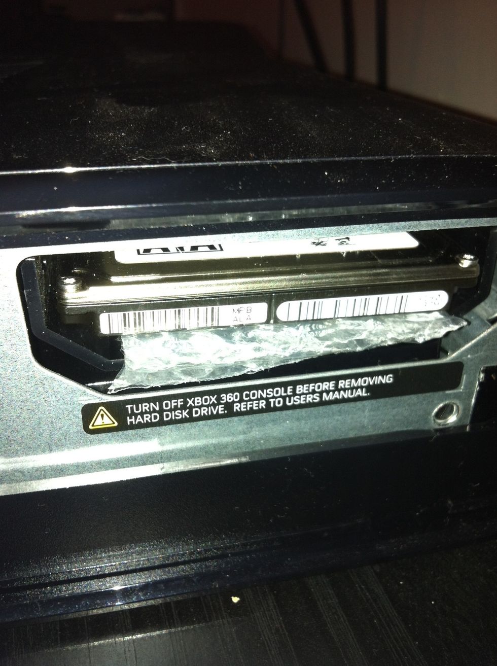 Look inside the hole. See two connectors that look very similar as the ones on your HD? Line those up and slide it in there with something non-conductive and heat resistant under it to support it