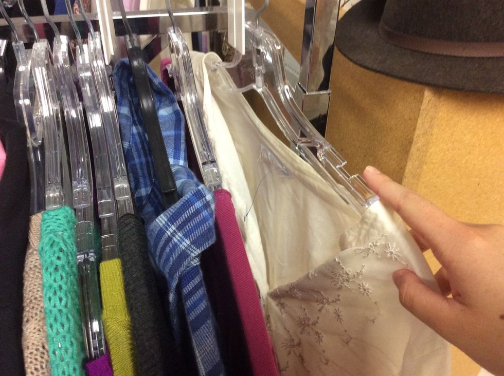 Look through clothes to find green tags