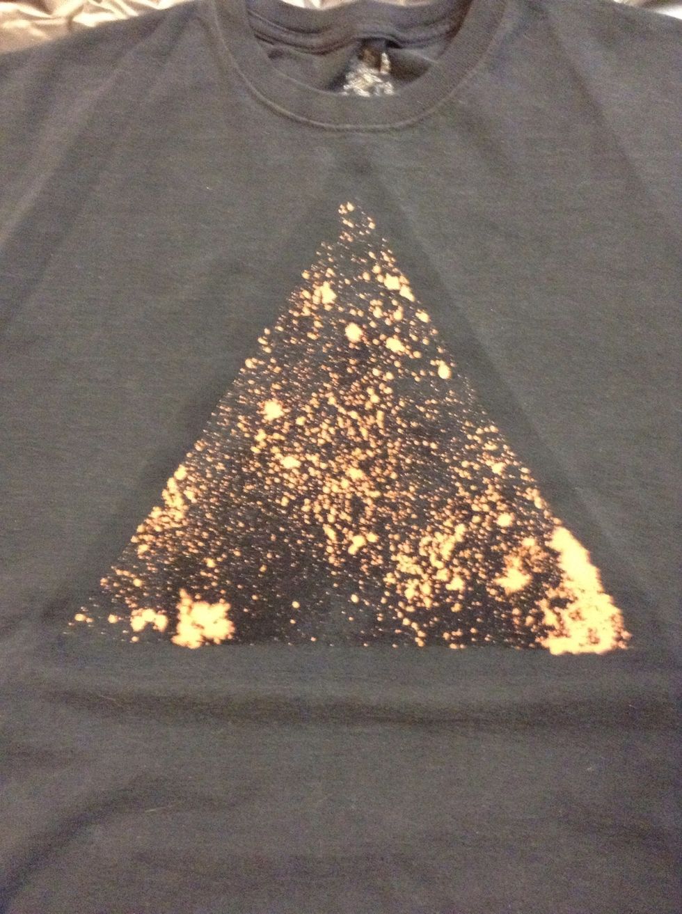 Lookin' good so far! Remove the newspapers and tape. Notice how much the bleach reacted compared to the last slide. Just a reminder to take it easy with the bleach!