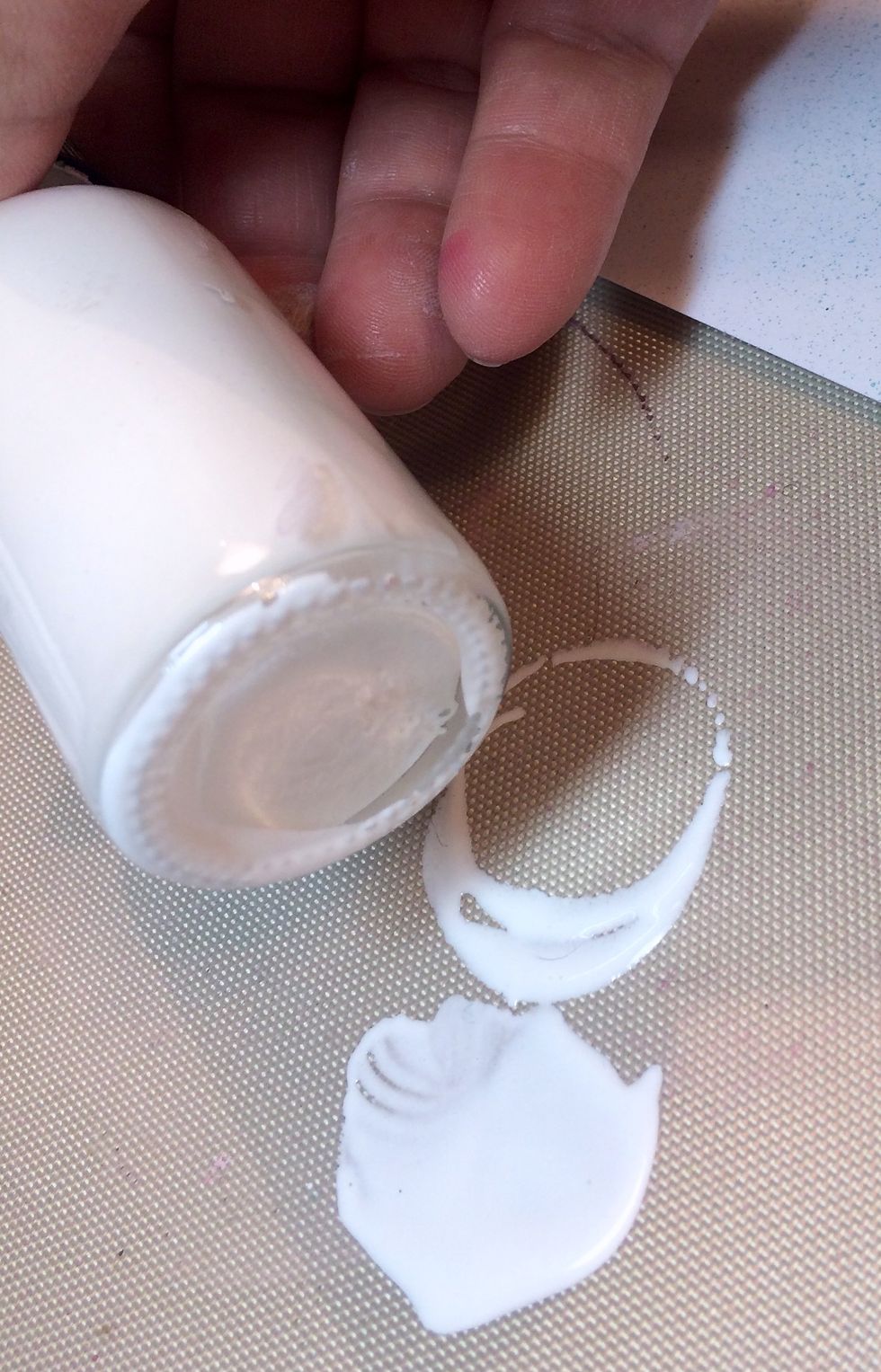 Looking to add some white circles to my layout, I decide to drip a bit of Immaculate Minx onto my Art Anthology Matt and dip the bottom of the bottle into it.