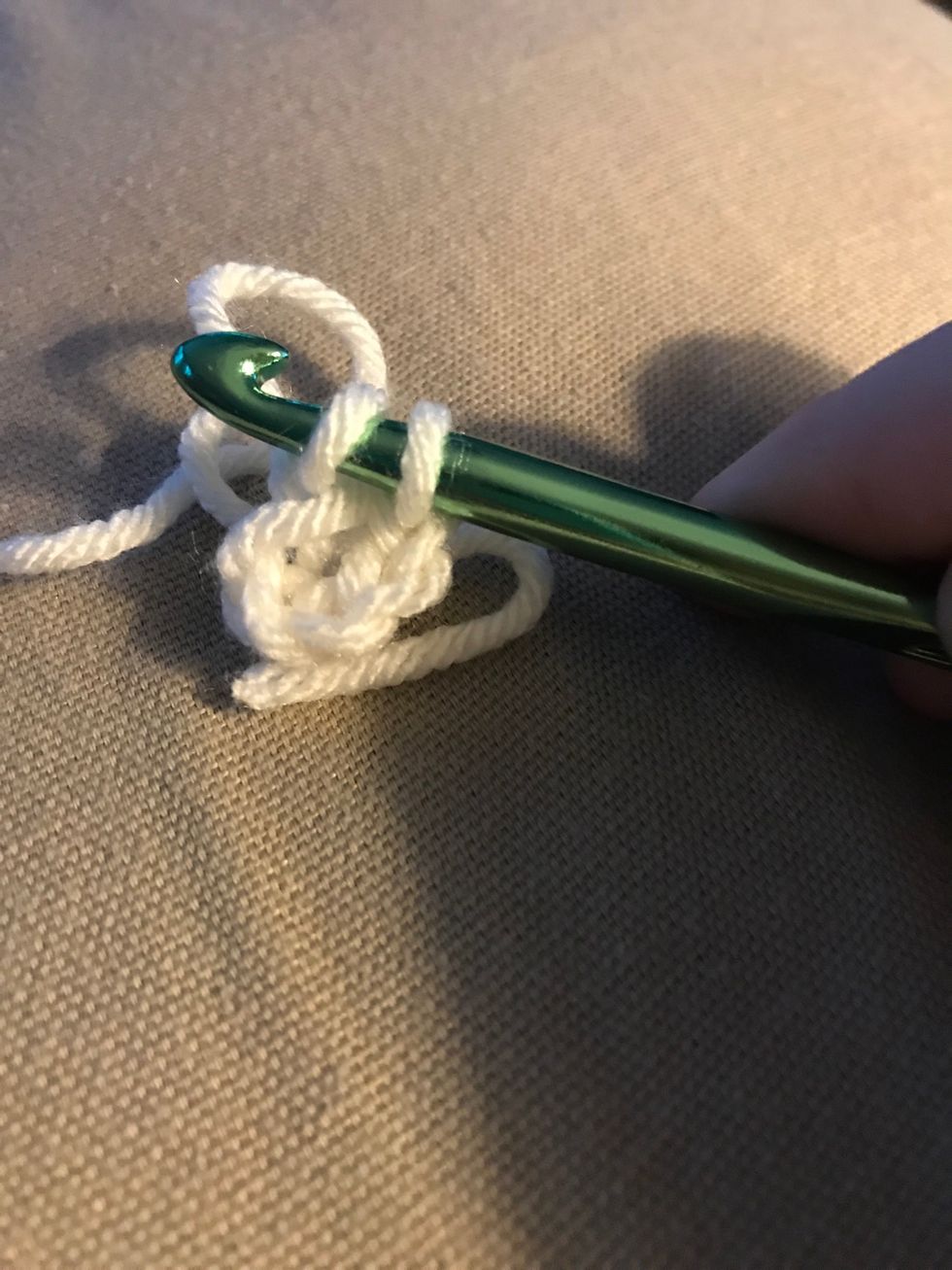 Loop 1 yarn then loop both. Of your not sure of this process refer to my lesson 2 guide.