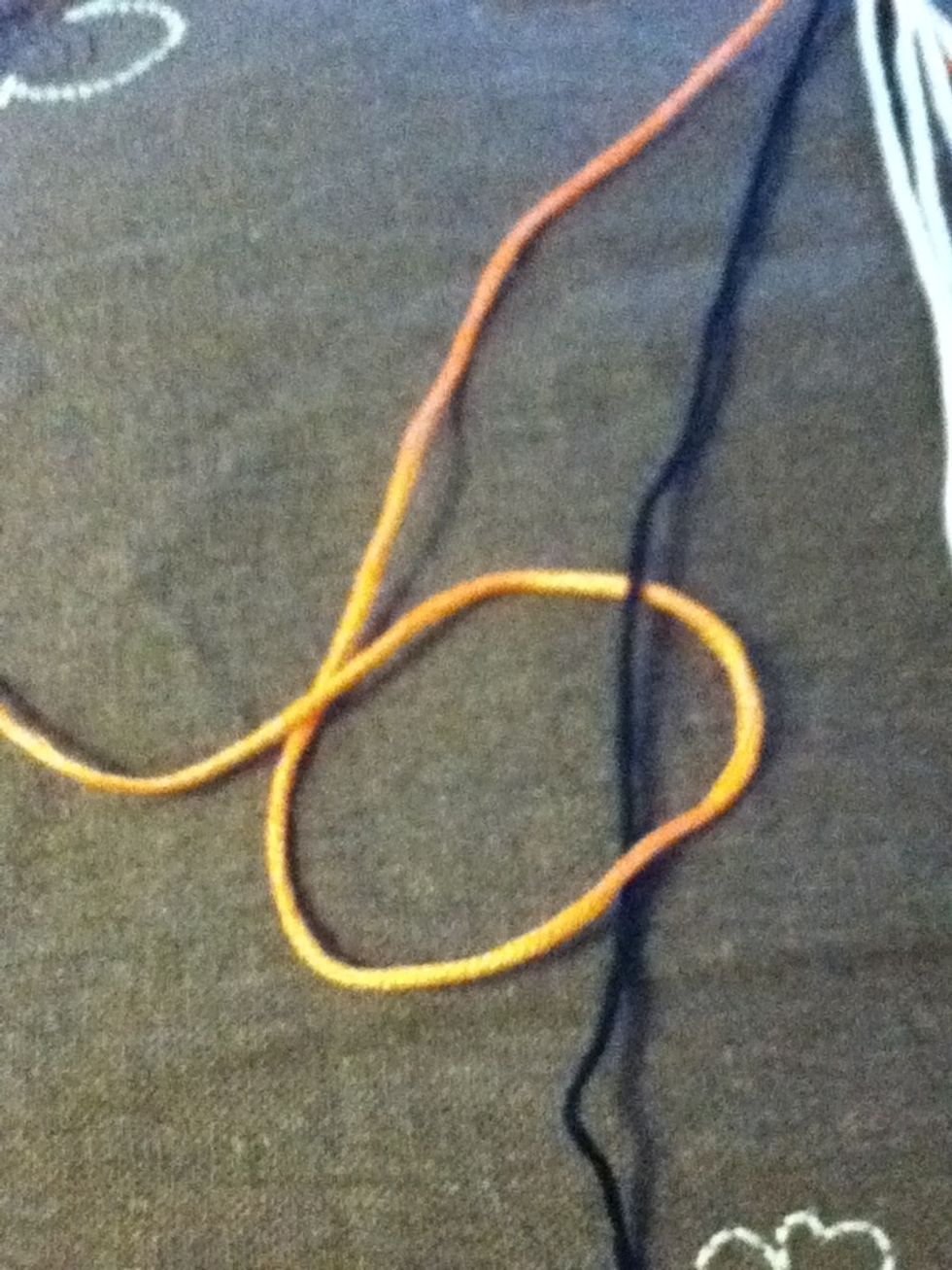 Loop border thread around the second thread then back over itself. Pull knot to top. This is called a forward knot.