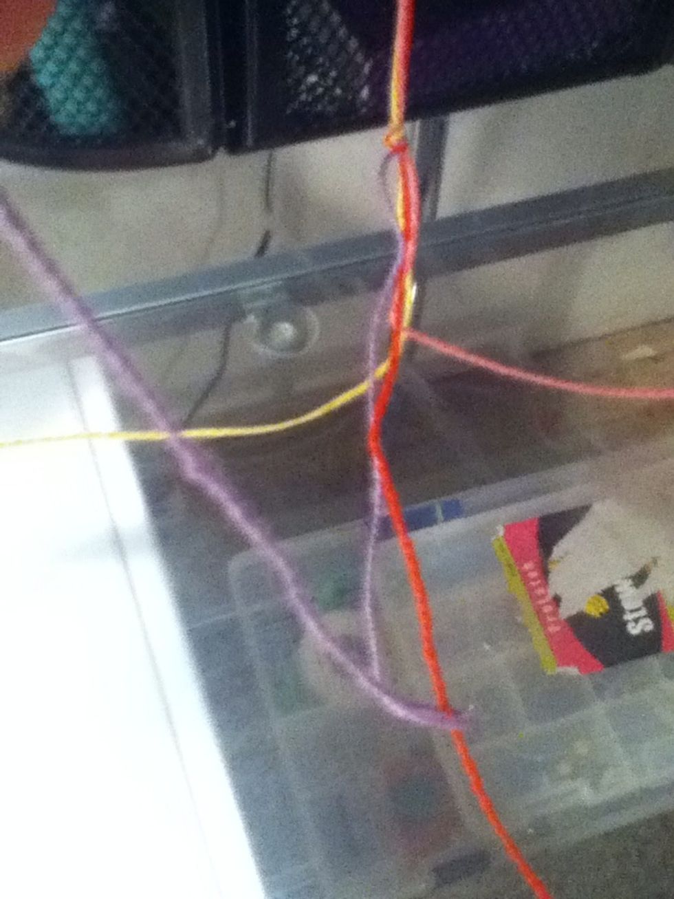 Loop it under and pull it tight. Repeat.