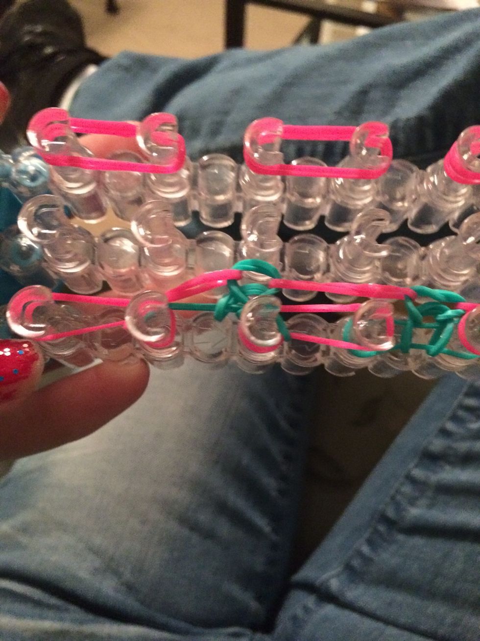 Loop over the first pink band under the blue band. Loop all the blue bands that are on the bottom, and loop the 2nd to last pink band.