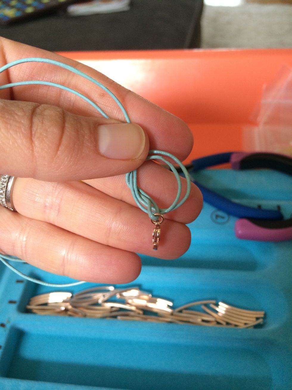 Loop the clasp through...