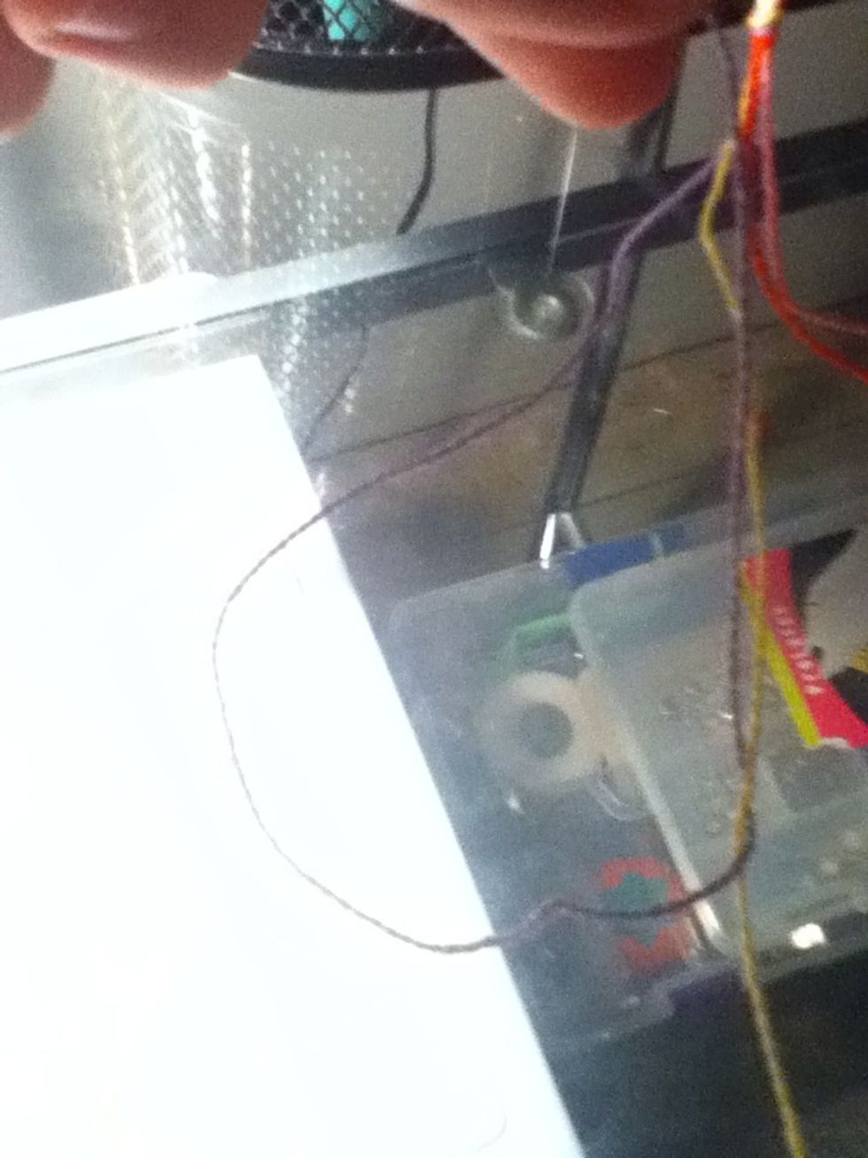 Loop the first string under the second string.