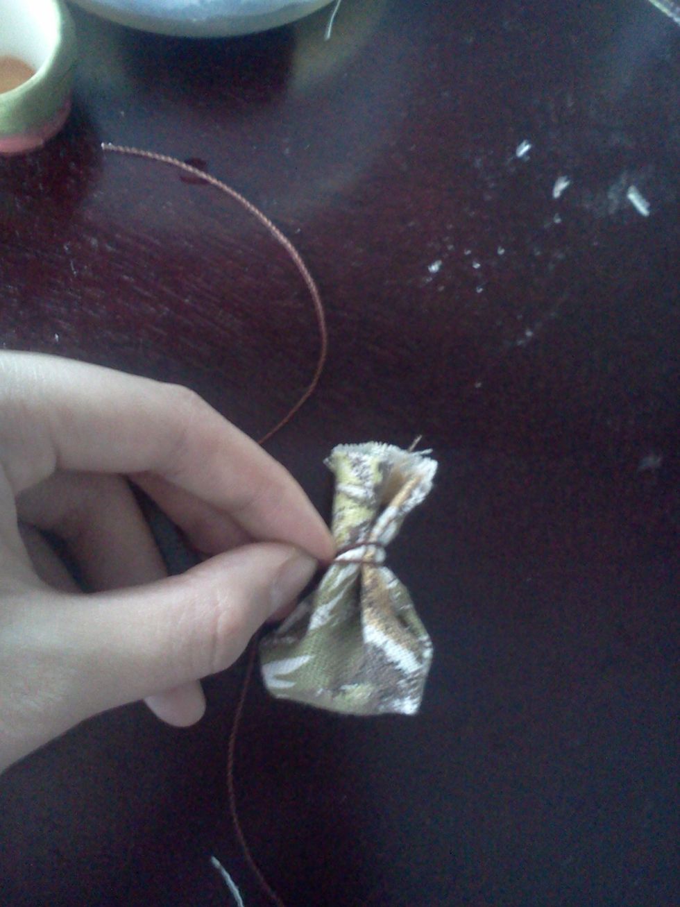 loop the string around and tie it