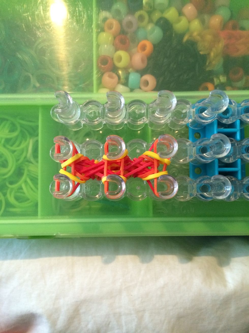 Loop the yellow bands.